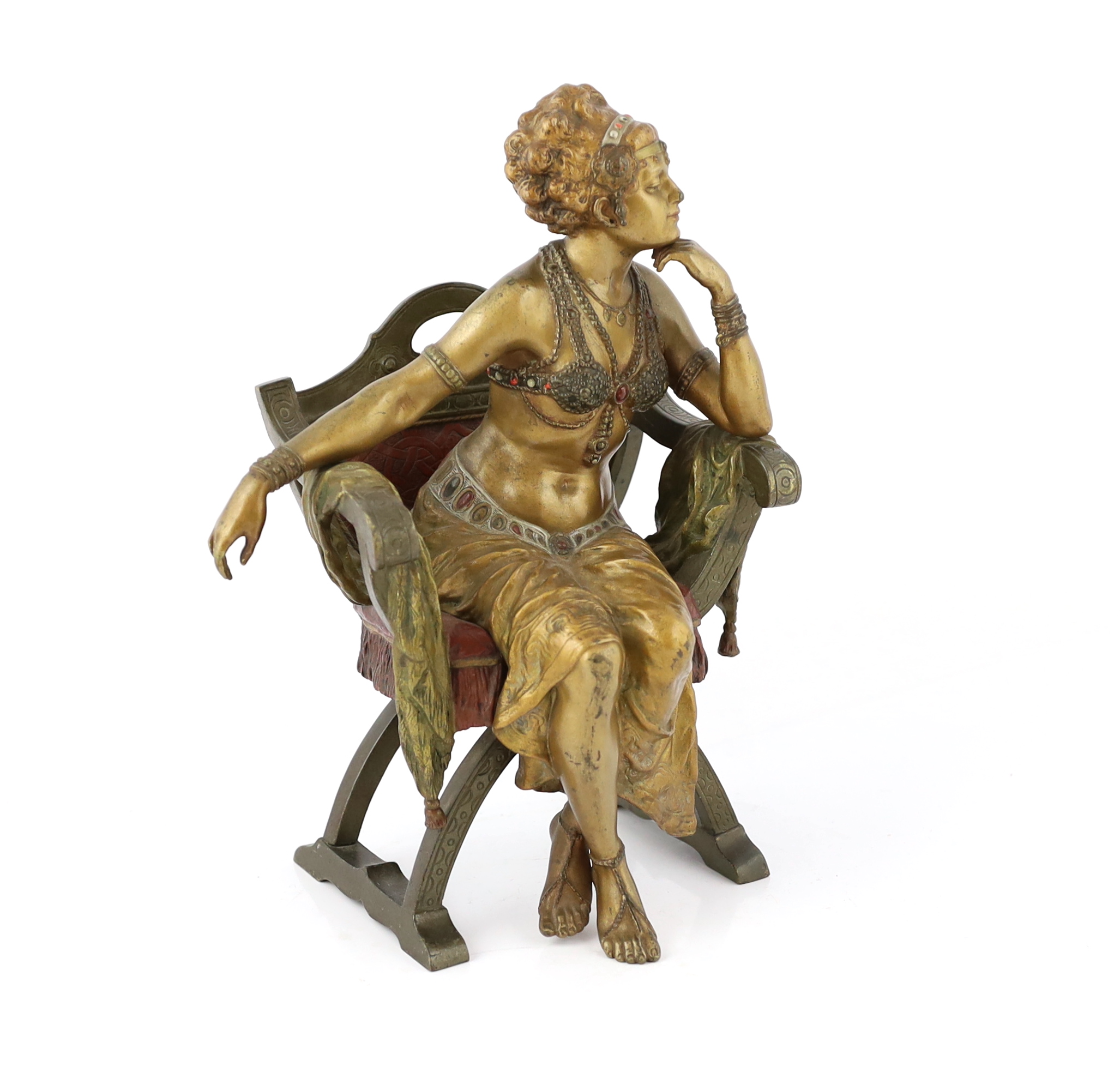 Franz Xavier Bergmann (1861-1936). An Austrian cold painted and patinated cast bronze figure of a Turkish dancing girl seated in an armchair, 20cm wide, 29cm high, Please note this lot attracts an additional import tax o